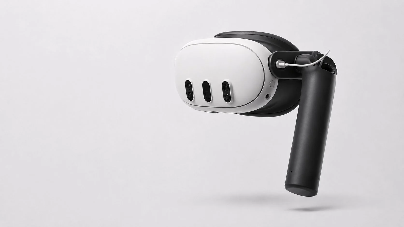 The XRHandle attached to an XR headset, shown on a light background.