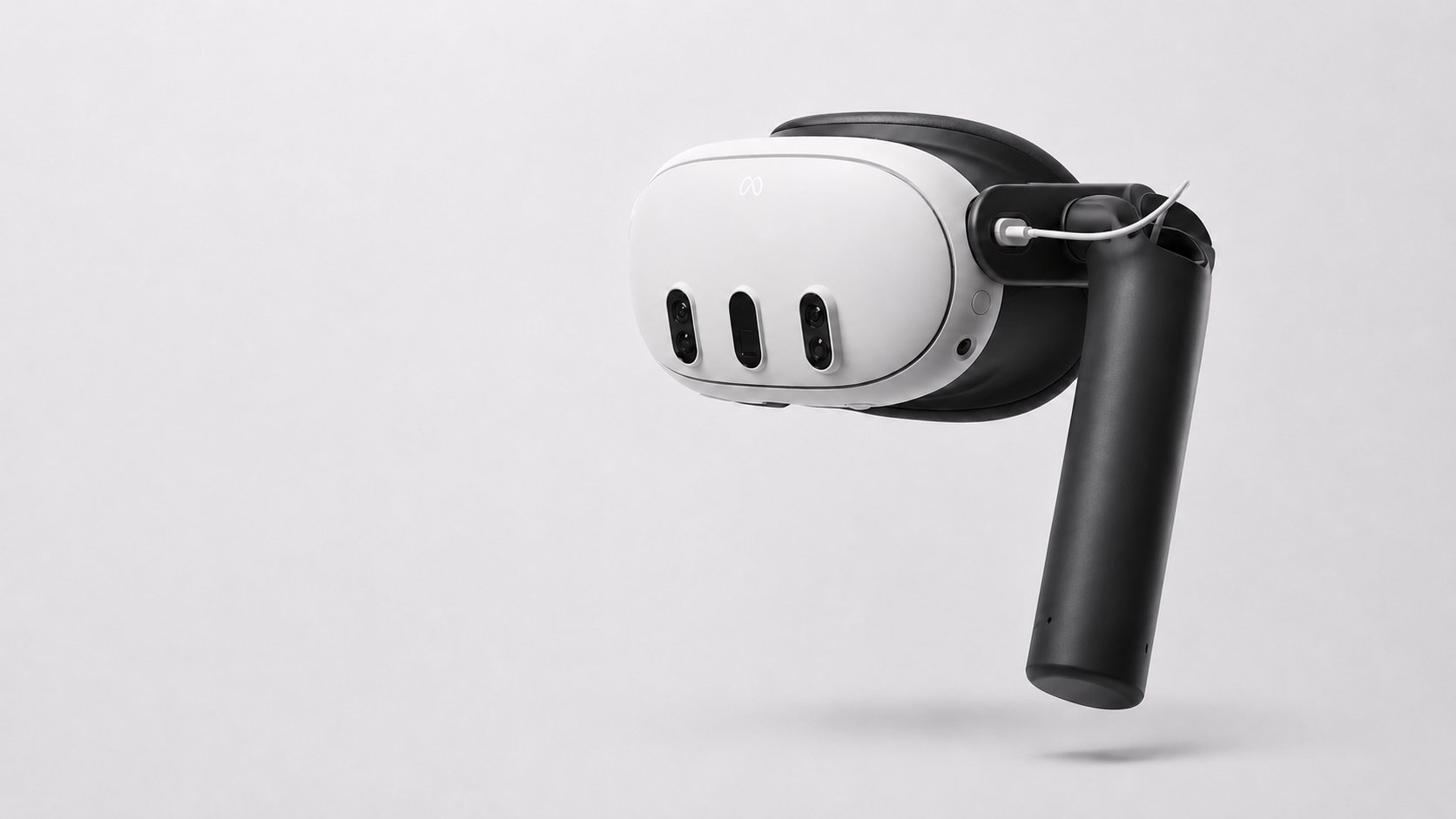 The XRHandle attached to an XR headset, shown on a light background.